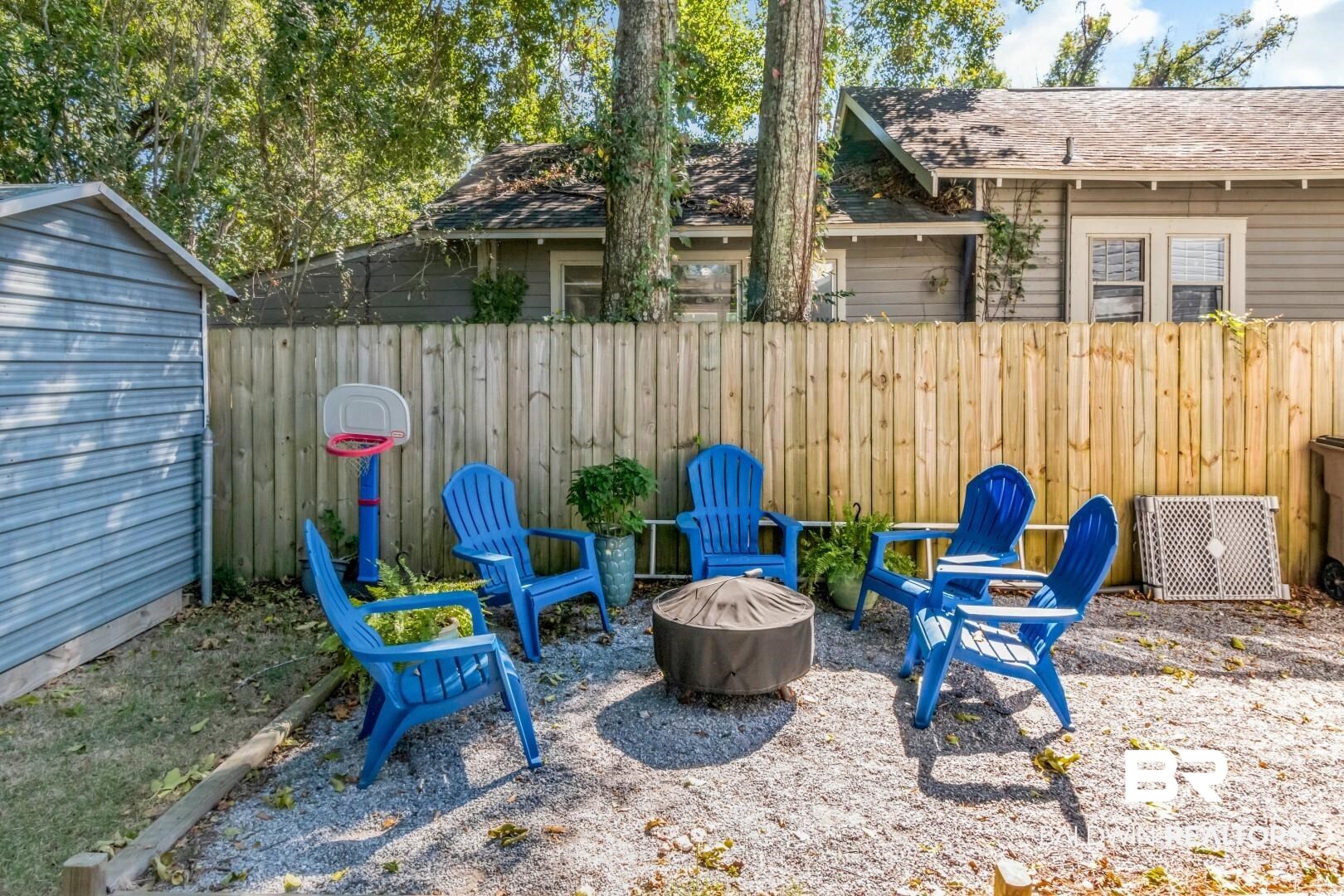 116 Item Avenue Mobile, AL 36607 - Photo 30 of 33 View of patio featuring an outdoor fire pit