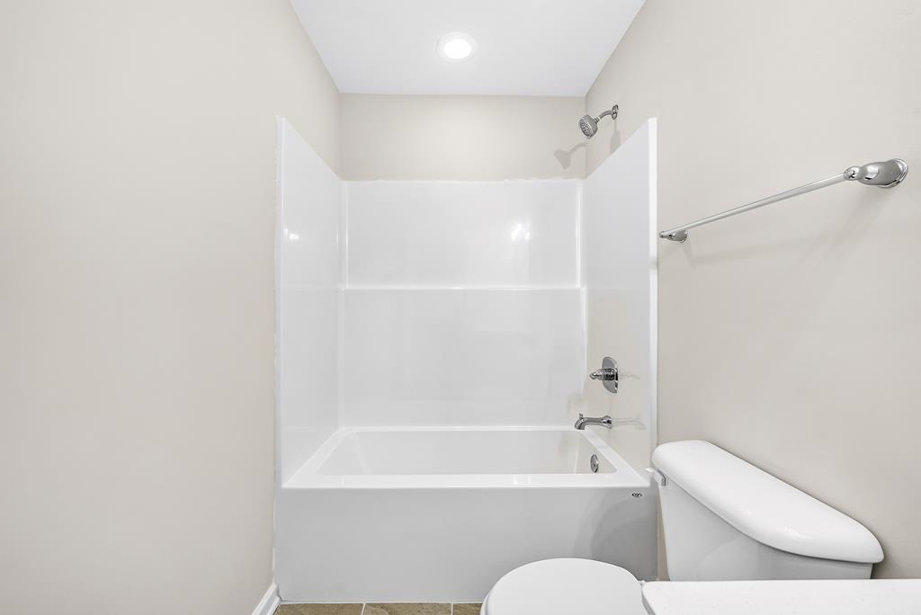 6 Liberty Place Fort Mitchell, AL 36856 - Photo 26 of 27 a bathroom with a toilet and a bath tub