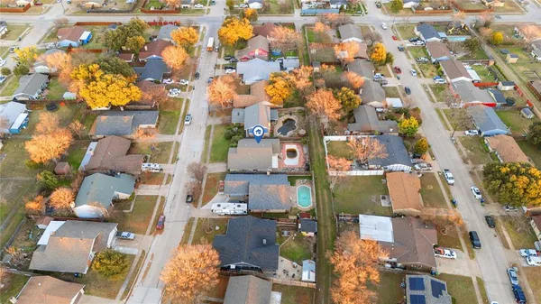 an aerial view of residential houses with outdoor space