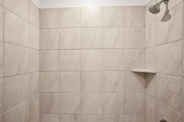 a bathroom with a bathtub shower sink and a toilet
