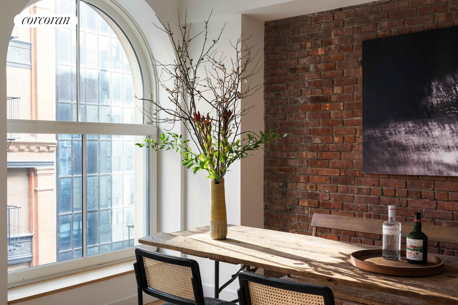 83 Walker Street, Unit 4 Manhattan, NY 10013 - Photo 4 of 21 a outdoor living space with furniture and a fireplace