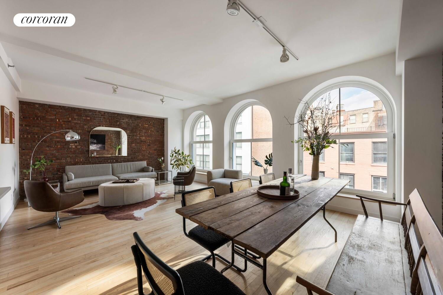 83 Walker Street, Unit 4 Manhattan, NY 10013 - Photo 5 of 21 a view of a livingroom with furniture window and wooden floor