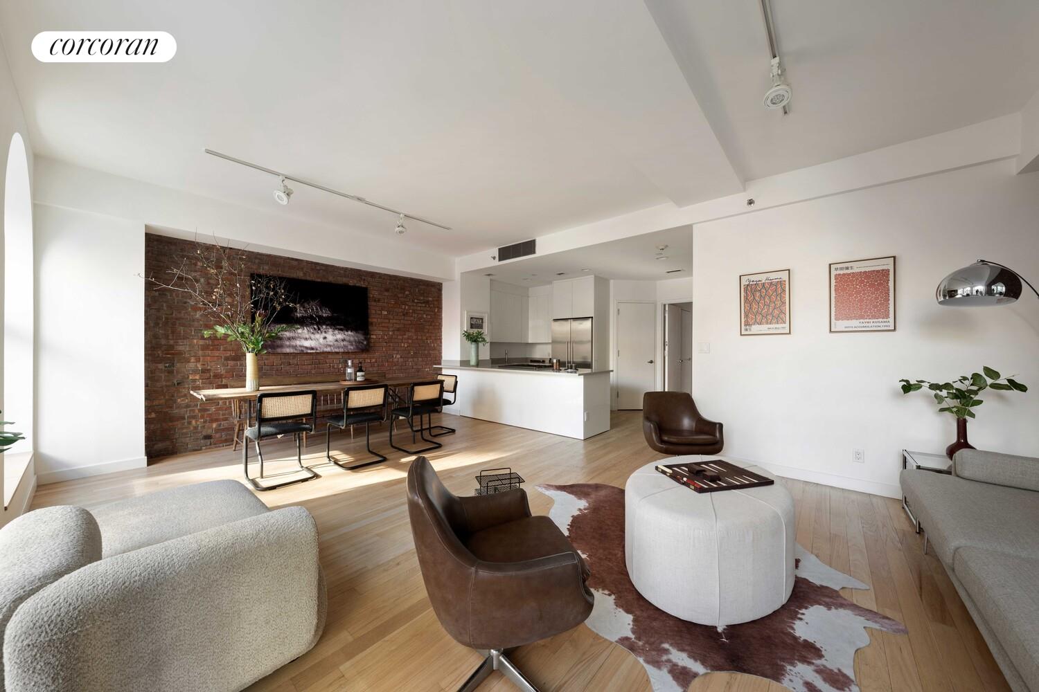 83 Walker Street, Unit 4 Manhattan, NY 10013 - Photo 7 of 21 a living room with furniture and a flat screen tv