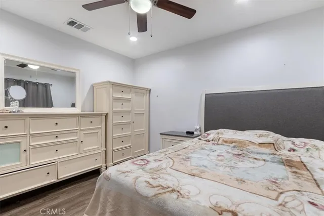 a bedroom with a bed and a dresser