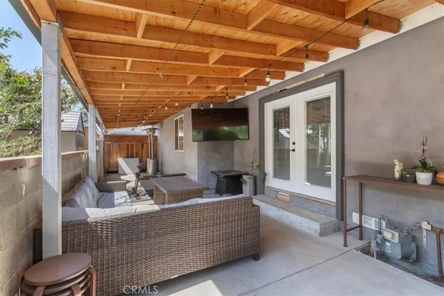 a view of living room kitchen with furniture and outdoor view
