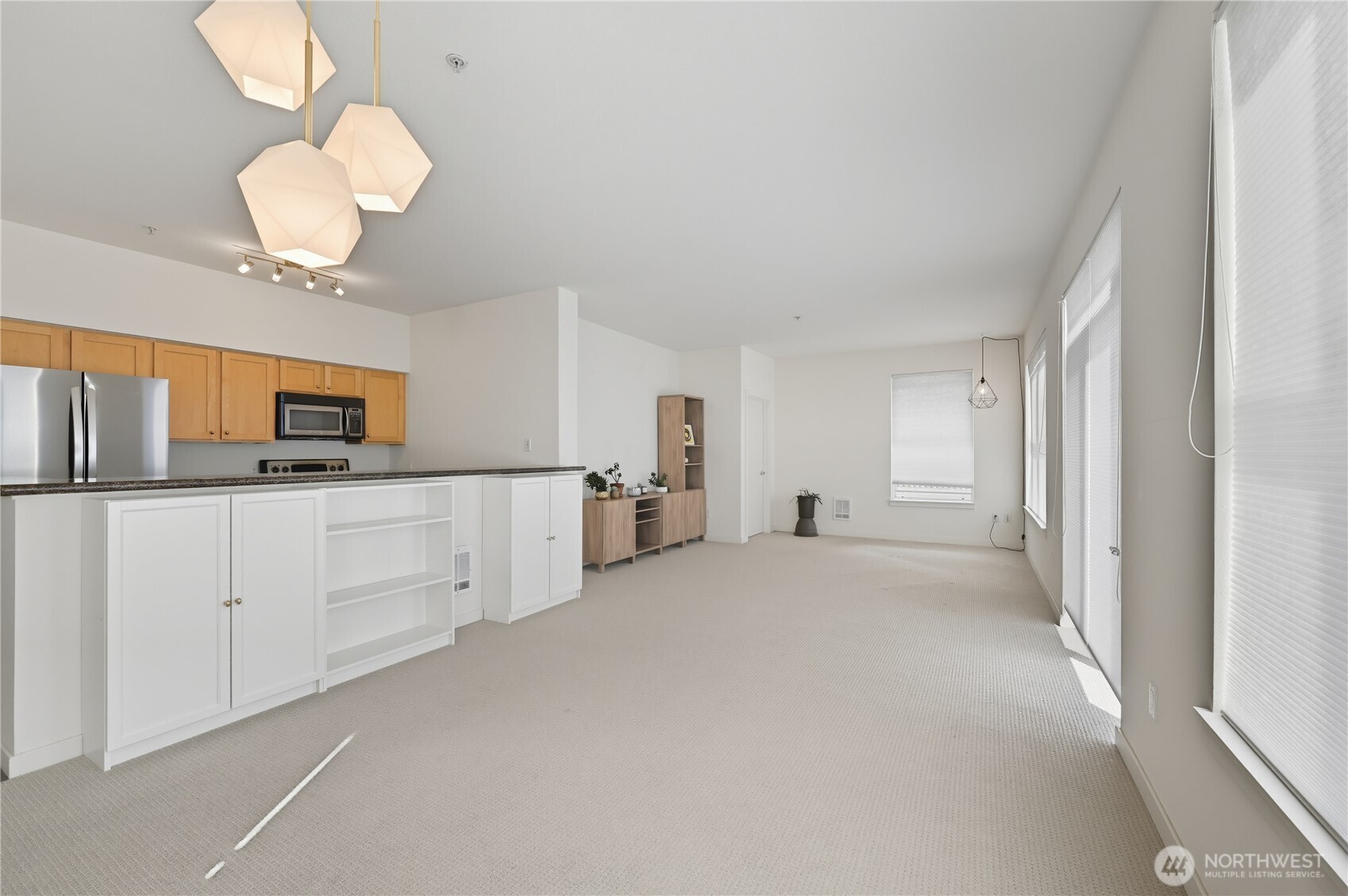 303 23rd Avenue South, Unit 602 Seattle, WA 98144 - Photo 1 of 26 a view of a kitchen with sink and cabinet area