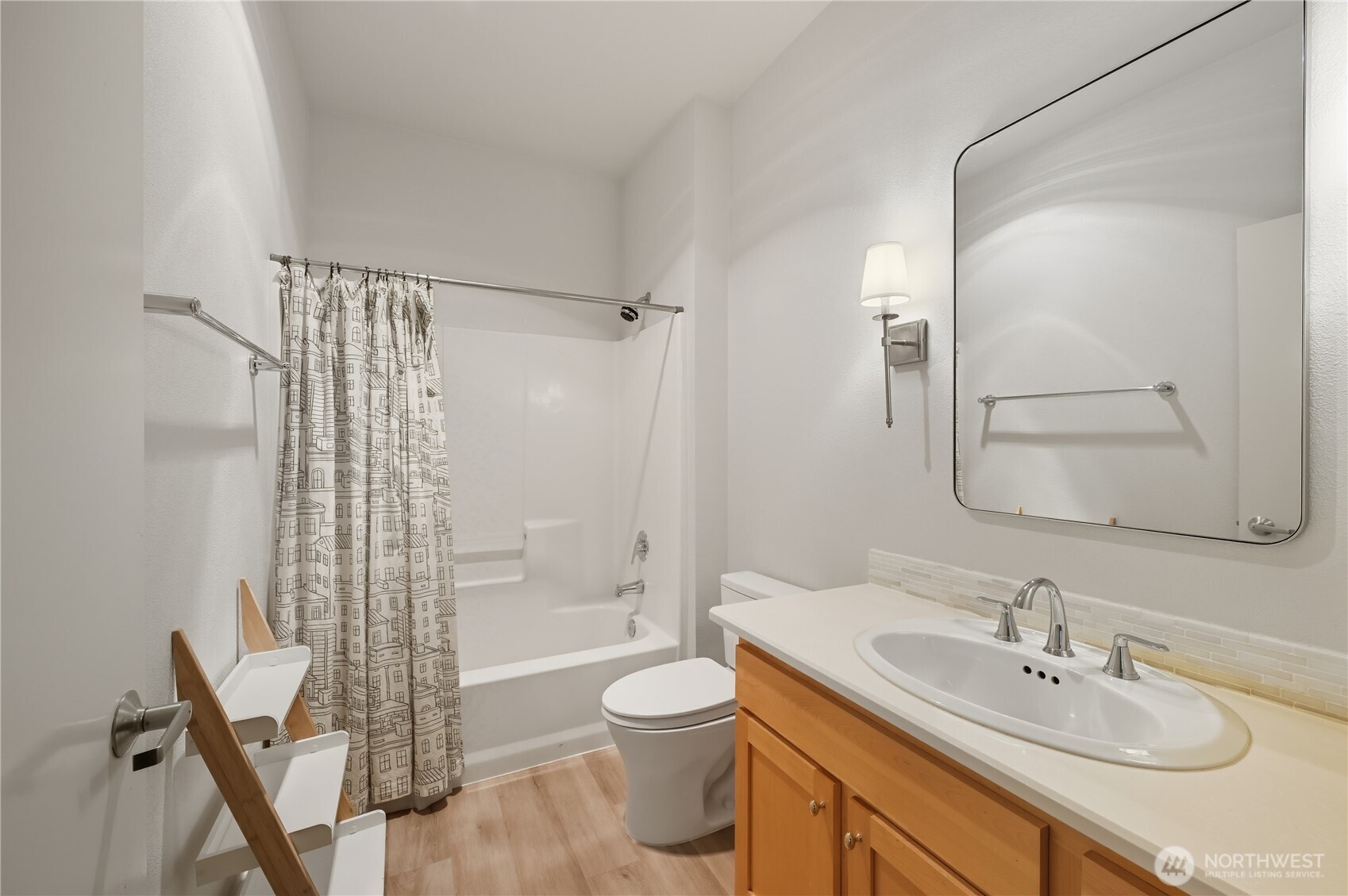 303 23rd Avenue South, Unit 602 Seattle, WA 98144 - Photo 20 of 26 a bathroom with a sink toilet a shower and a mirror