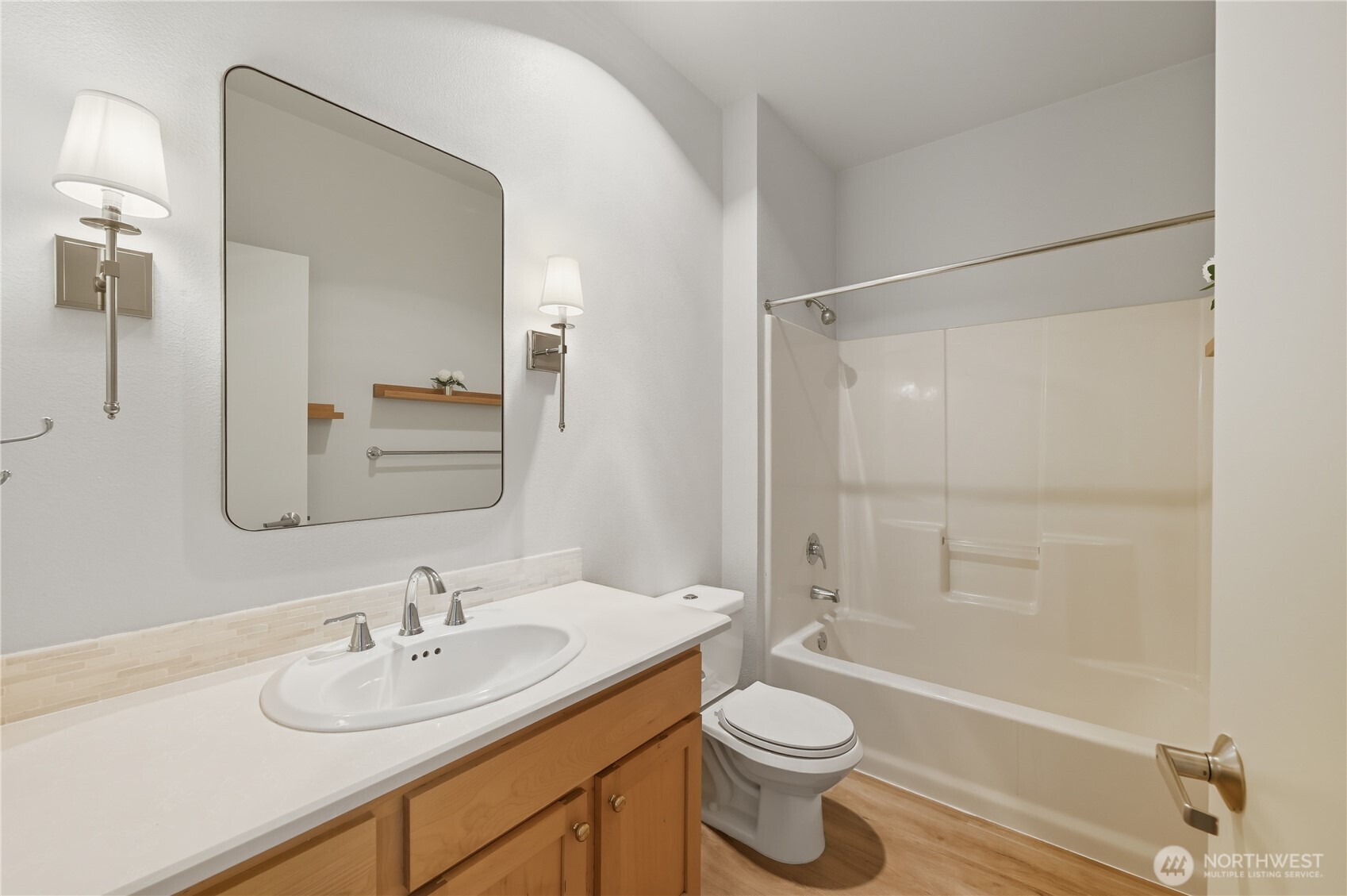 303 23rd Avenue South, Unit 602 Seattle, WA 98144 - Photo 6 of 26 a bathroom with a sink a toilet and shower