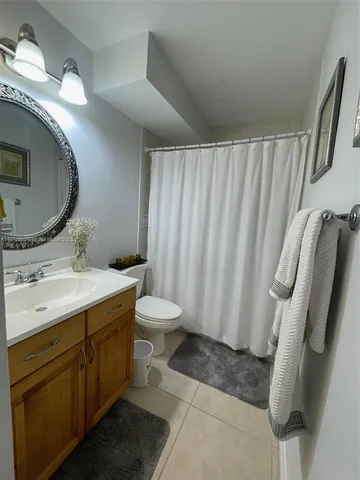 a view of a bathroom with a sink and mirror