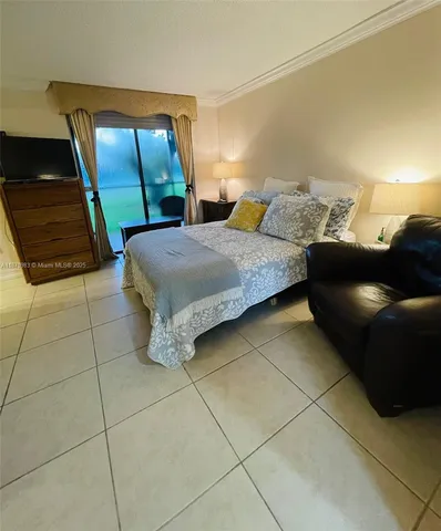 a bedroom with a bed and a mirror