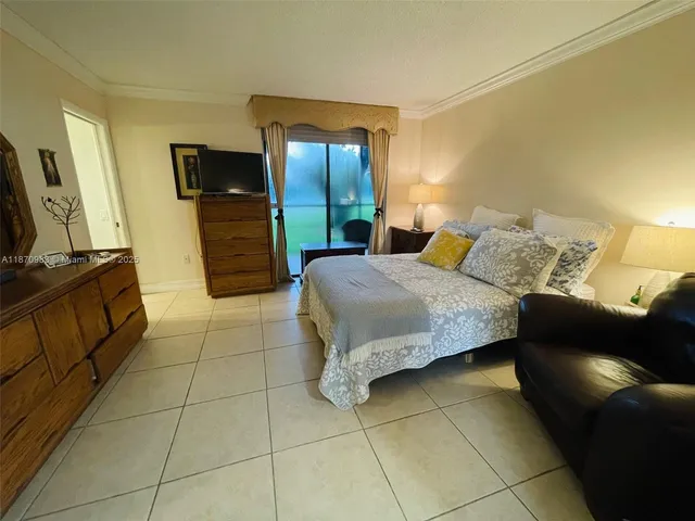 a bedroom with a bed and a television in it