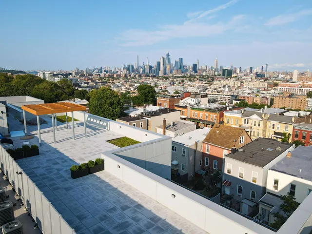 a view of a city from the roof deck