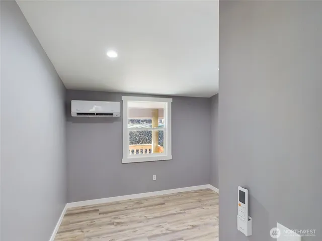 a view of an empty room with a window