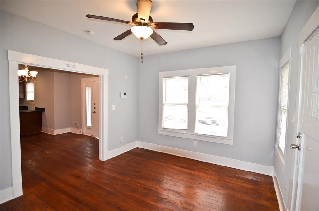 1905 Stevens Street, Unit 2 Houston, TX 77026 - Photo 12 of 22 a view of an empty room with wooden floor and a window