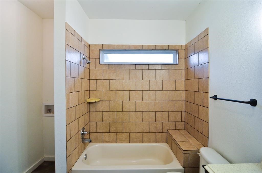 1905 Stevens Street, Unit 2 Houston, TX 77026 - Photo 17 of 22 a bathroom with a bathtub and shower
