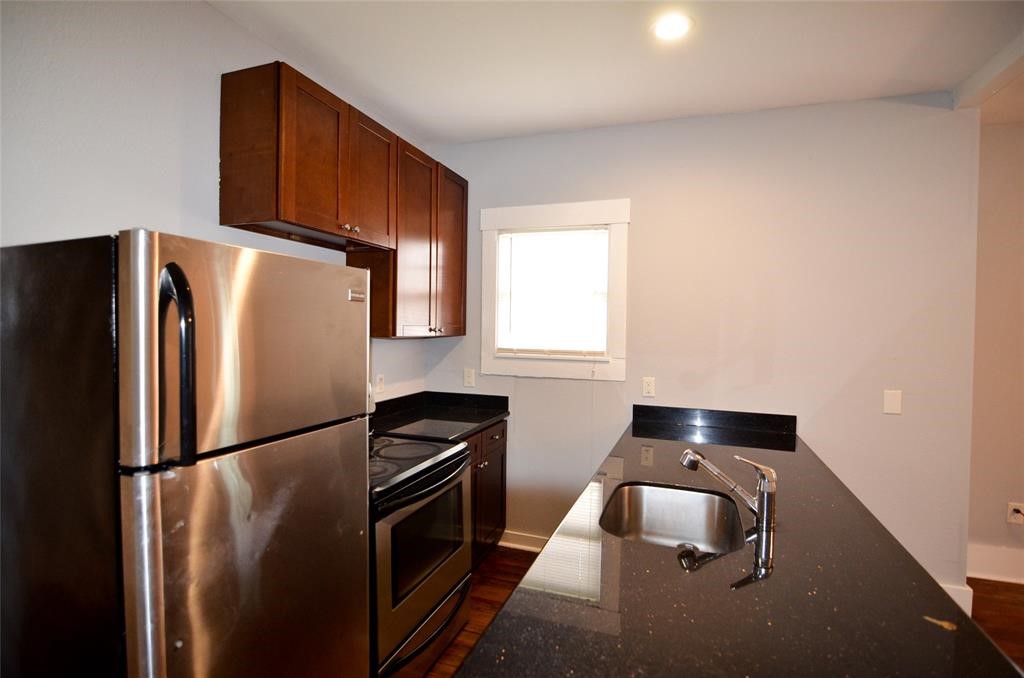 1905 Stevens Street, Unit 2 Houston, TX 77026 - Photo 10 of 22 a kitchen with metallic refrigerator and stove
