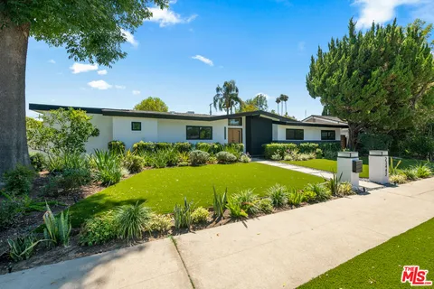 a view of a house with a swimming pool
