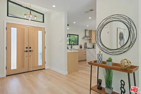 a view of a hallway with washer and dryer