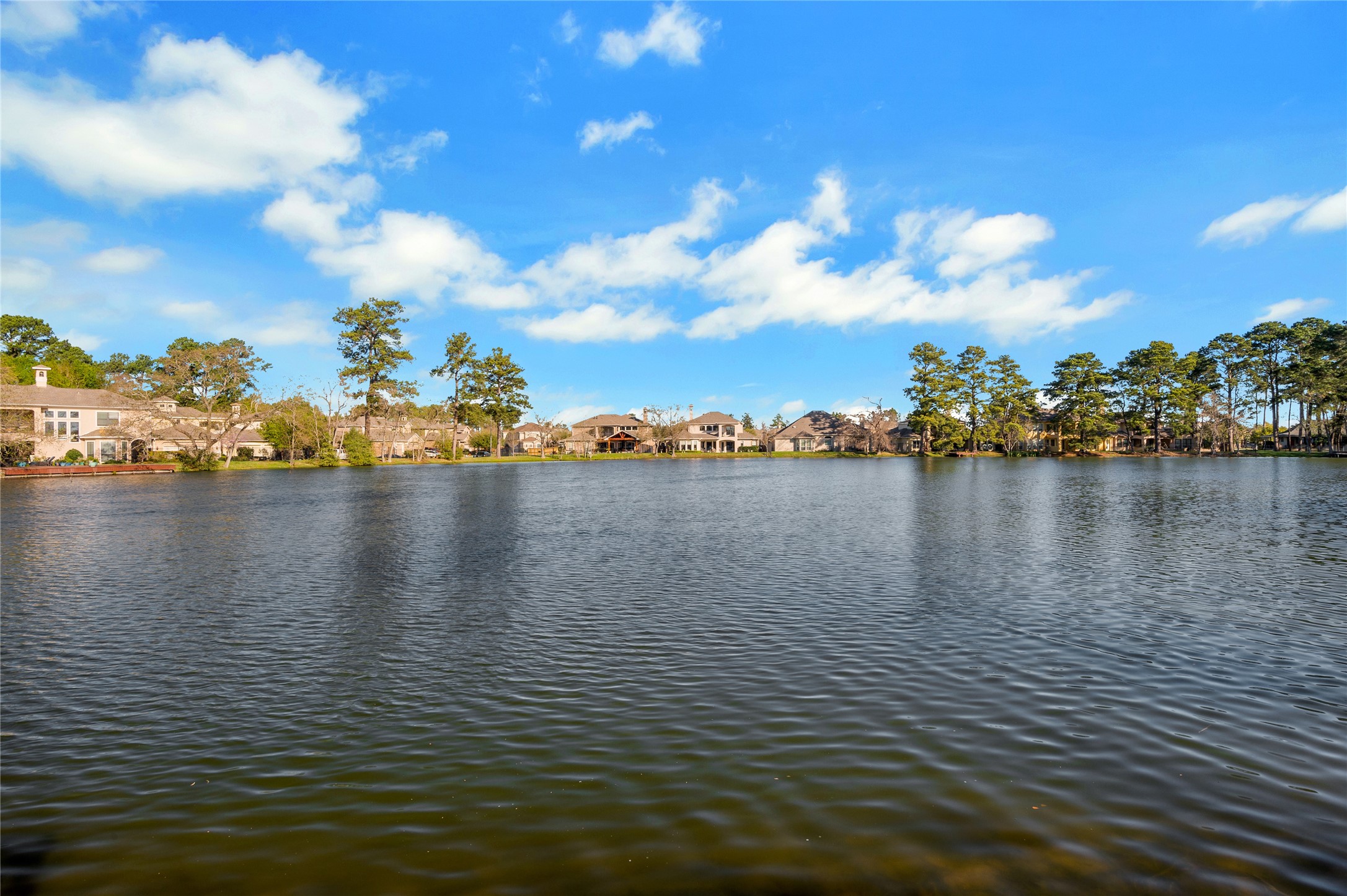 6119 Lofty Lane Spring, TX 77379 - Photo 19 of 40 Wake up to breathtaking sunrises over the tranquil lake.