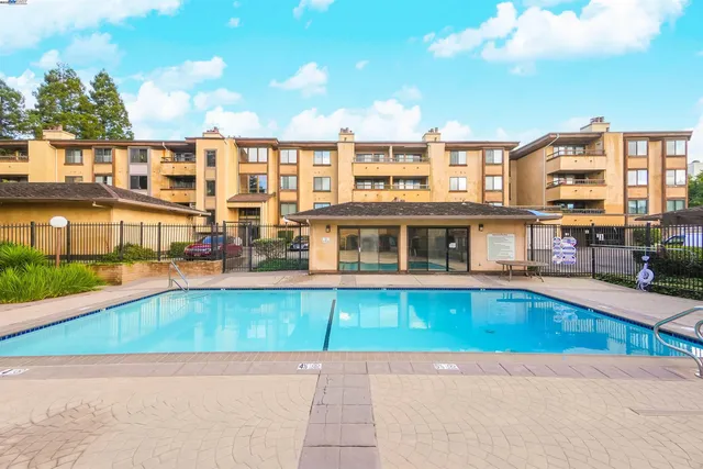 a view of a swimming pool with a patio