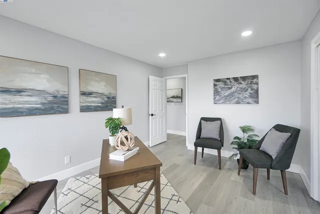 a bathroom with a granite countertop sink a toilet and a mirror