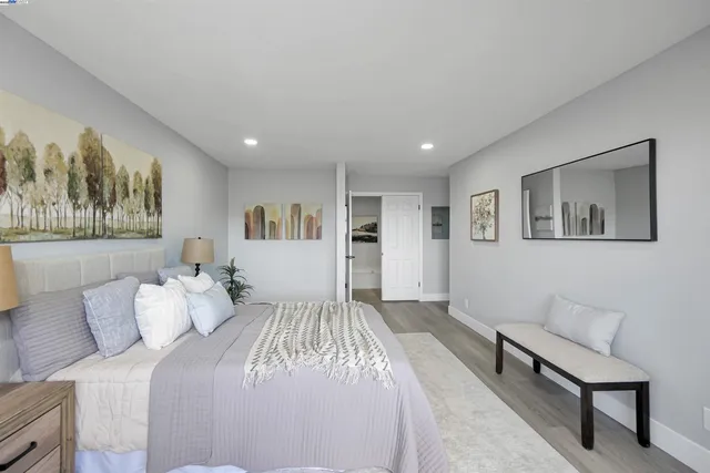 a bath room with a bathtub and a potted plant