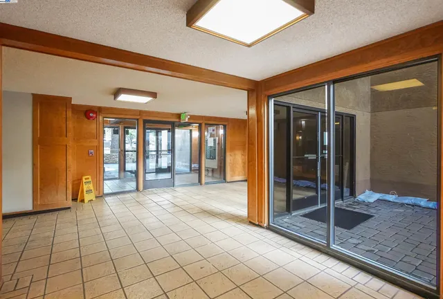 a view of a hallway with windows