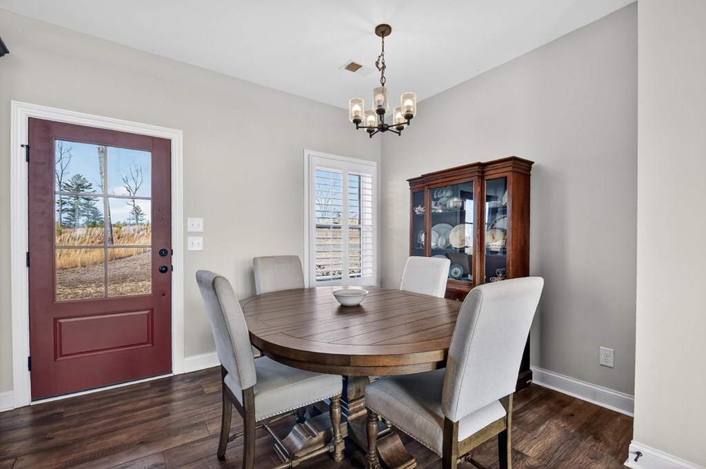 28 Mountaintown Road Ellijay, GA 30540 - Photo 11 of 54 a view of a dining room with furniture window and wooden floor