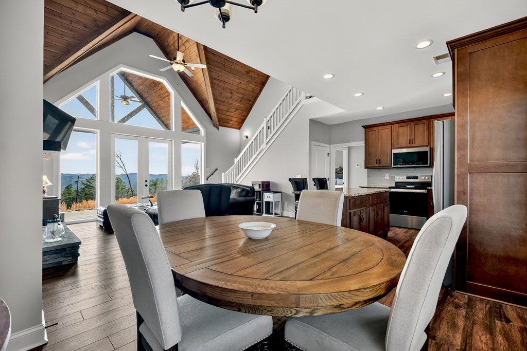 28 Mountaintown Road Ellijay, GA 30540 - Photo 12 of 54 a view of a dining room with furniture window and wooden floor