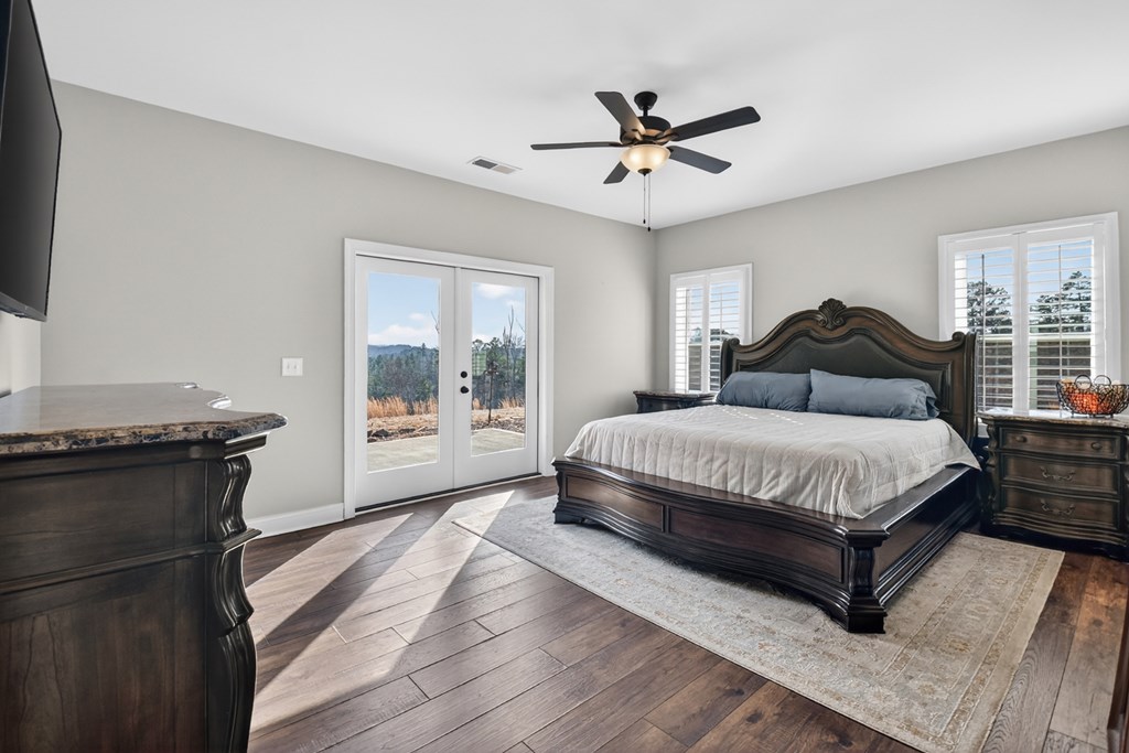 28 Mountaintown Road Ellijay, GA 30540 - Photo 20 of 54 a bedroom with a large bed and a window