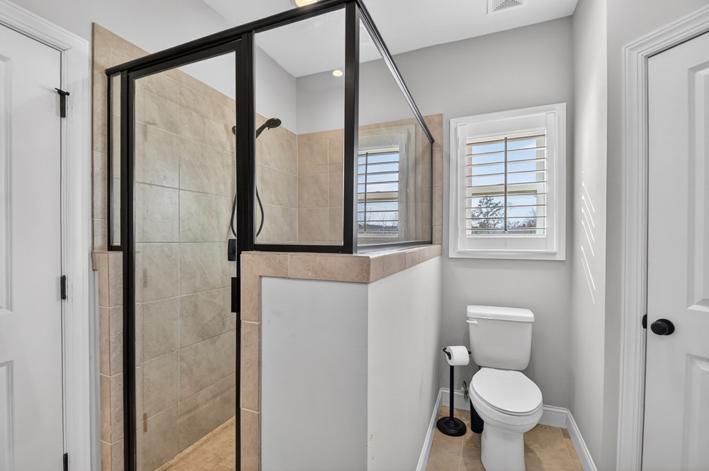 28 Mountaintown Road Ellijay, GA 30540 - Photo 24 of 54 a bathroom with a toilet and a shower