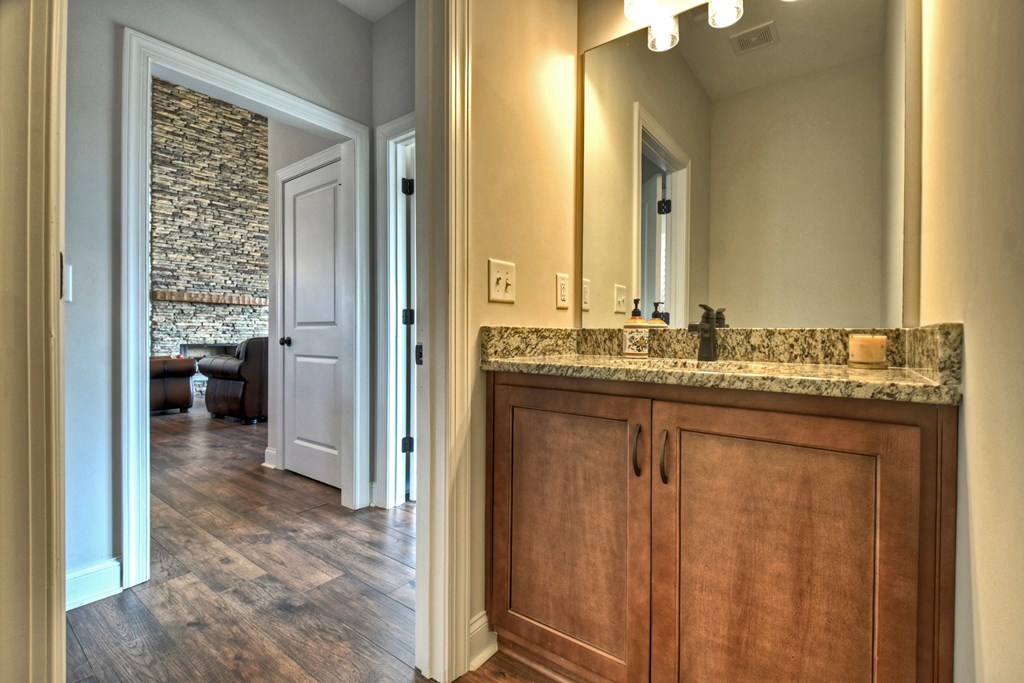 28 Mountaintown Road Ellijay, GA 30540 - Photo 28 of 54 a bathroom with a granite countertop sink a mirror and a bathtub
