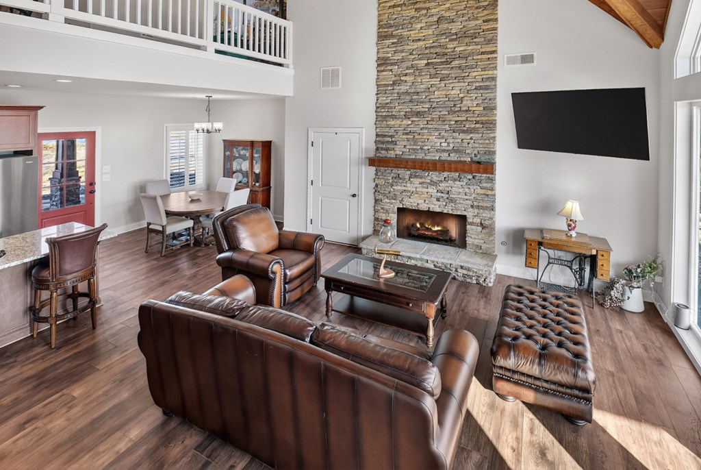 28 Mountaintown Road Ellijay, GA 30540 - Photo 29 of 54 a living room with furniture a flat screen tv and a fireplace