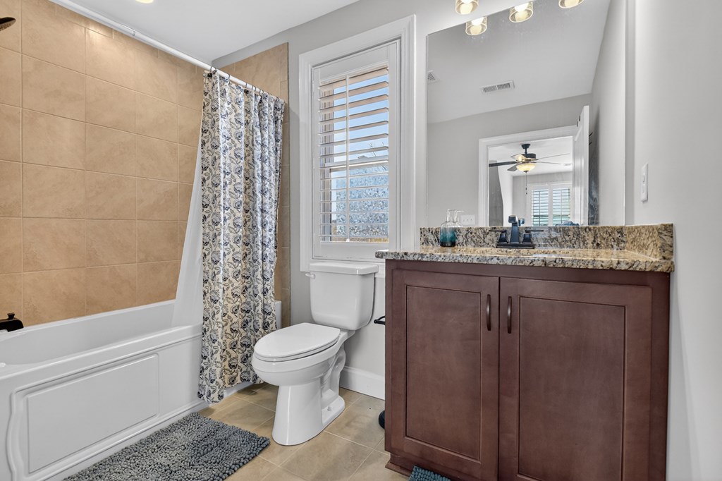 28 Mountaintown Road Ellijay, GA 30540 - Photo 33 of 54 a bathroom with a granite countertop sink toilet and shower