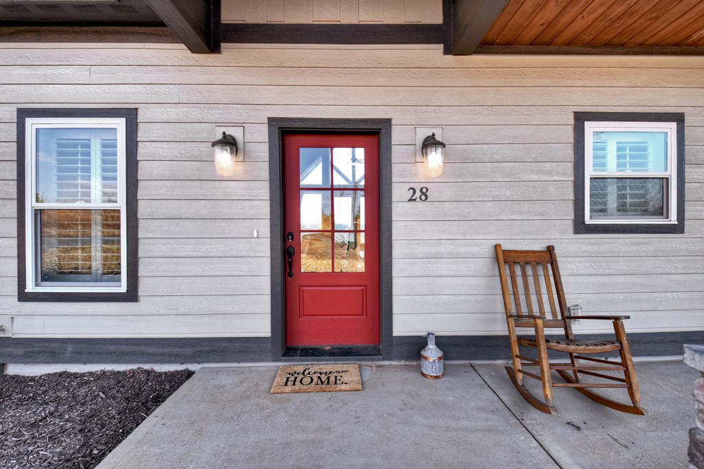 28 Mountaintown Road Ellijay, GA 30540 - Photo 6 of 54 a front view of a house with a bench