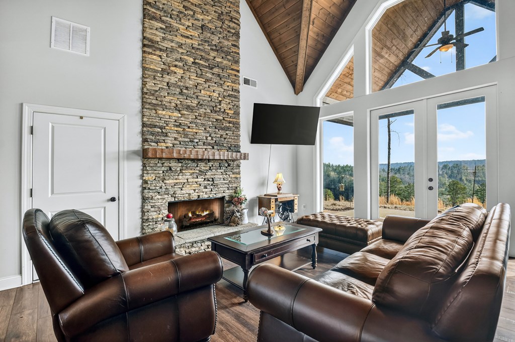 28 Mountaintown Road Ellijay, GA 30540 - Photo 7 of 54 a living room with furniture fireplace and a large window