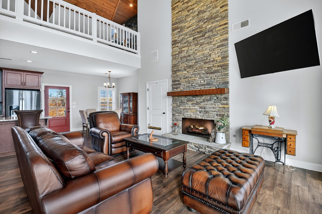 28 Mountaintown Road Ellijay, GA 30540 - Photo 8 of 54 a living room with furniture a flat screen tv and a fireplace