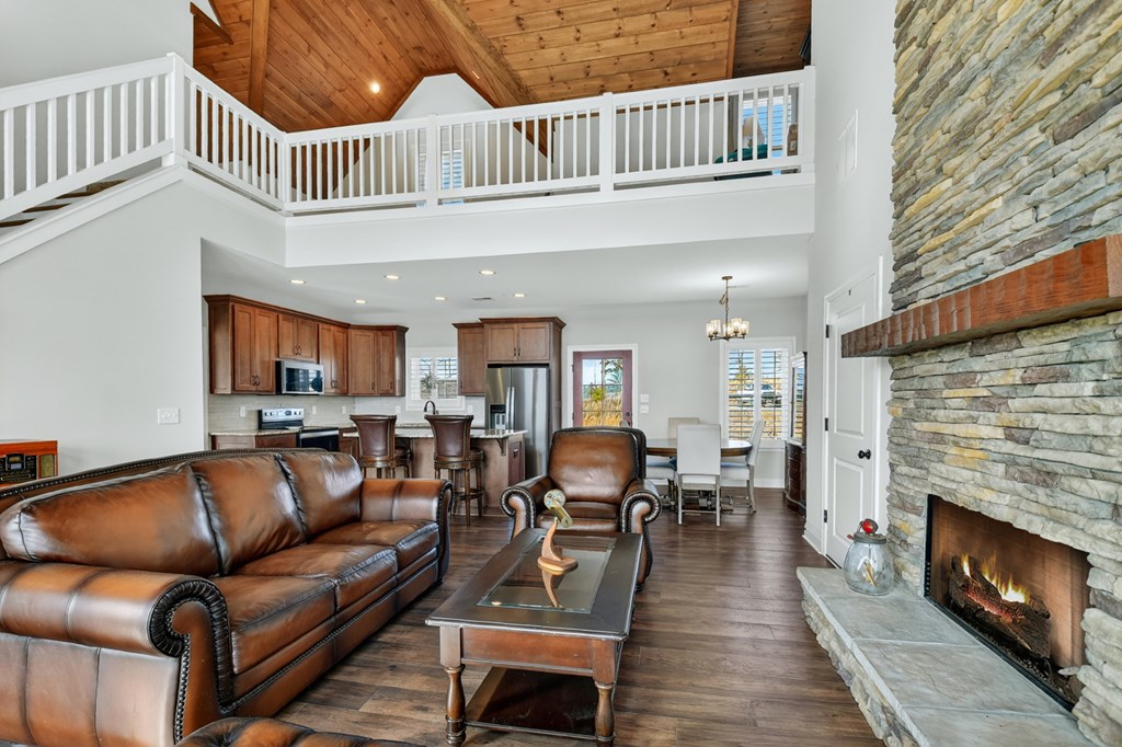 28 Mountaintown Road Ellijay, GA 30540 - Photo 9 of 54 a living room with furniture a fireplace and a wooden floor