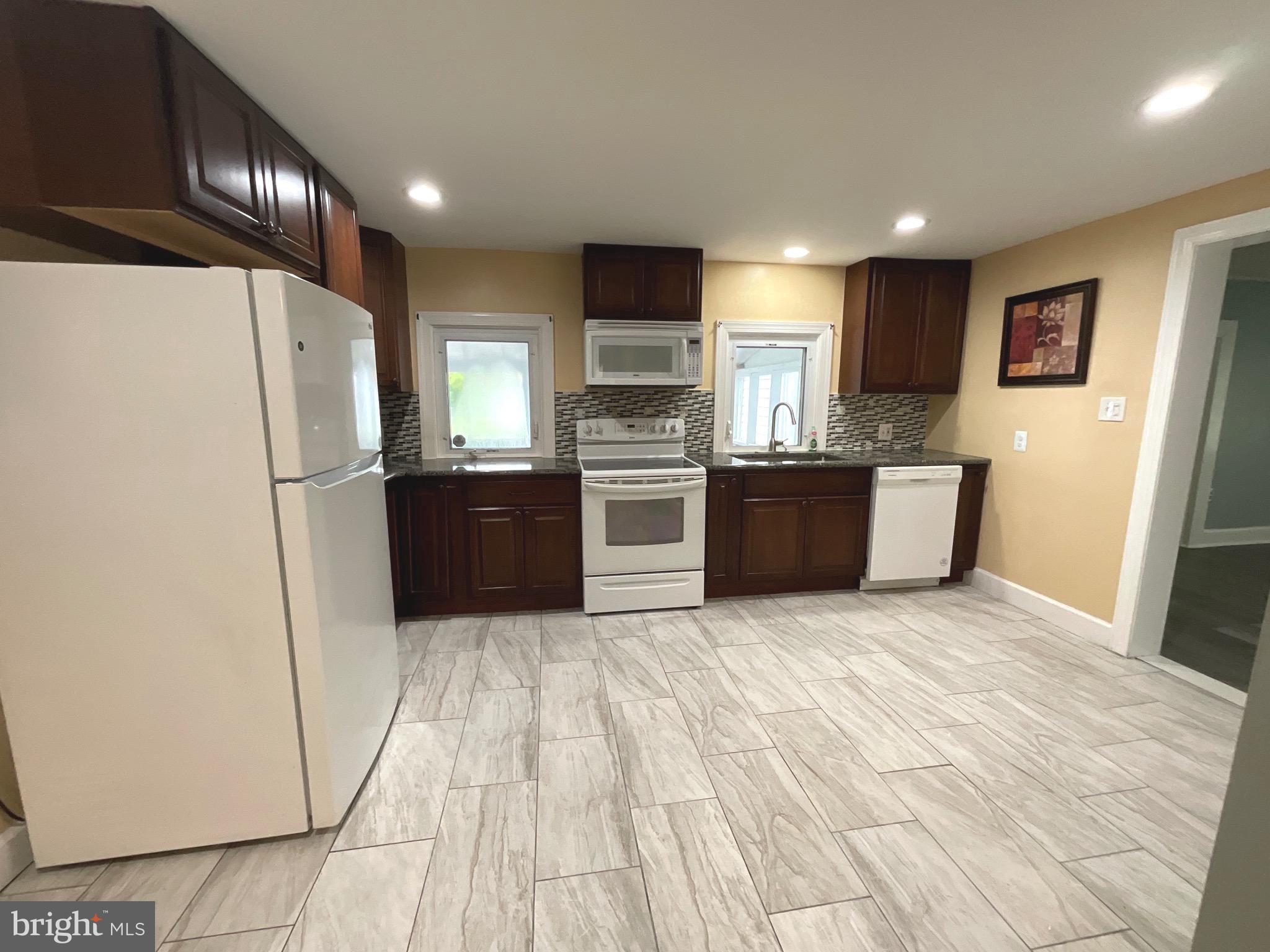 86 Kelley Road Fredericksburg, VA 22405 - Photo 11 of 36 a kitchen with stainless steel appliances a refrigerator and a stove top oven