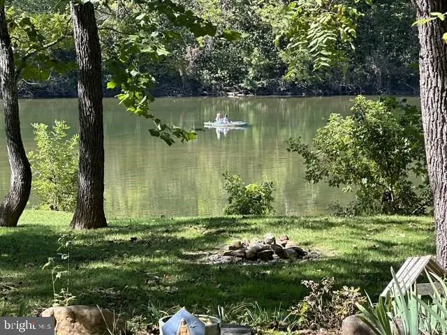 a view of a lake with a yard