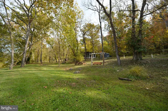 a view of a house with a green space area