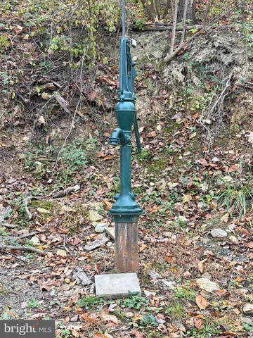 a view of lake with a yard