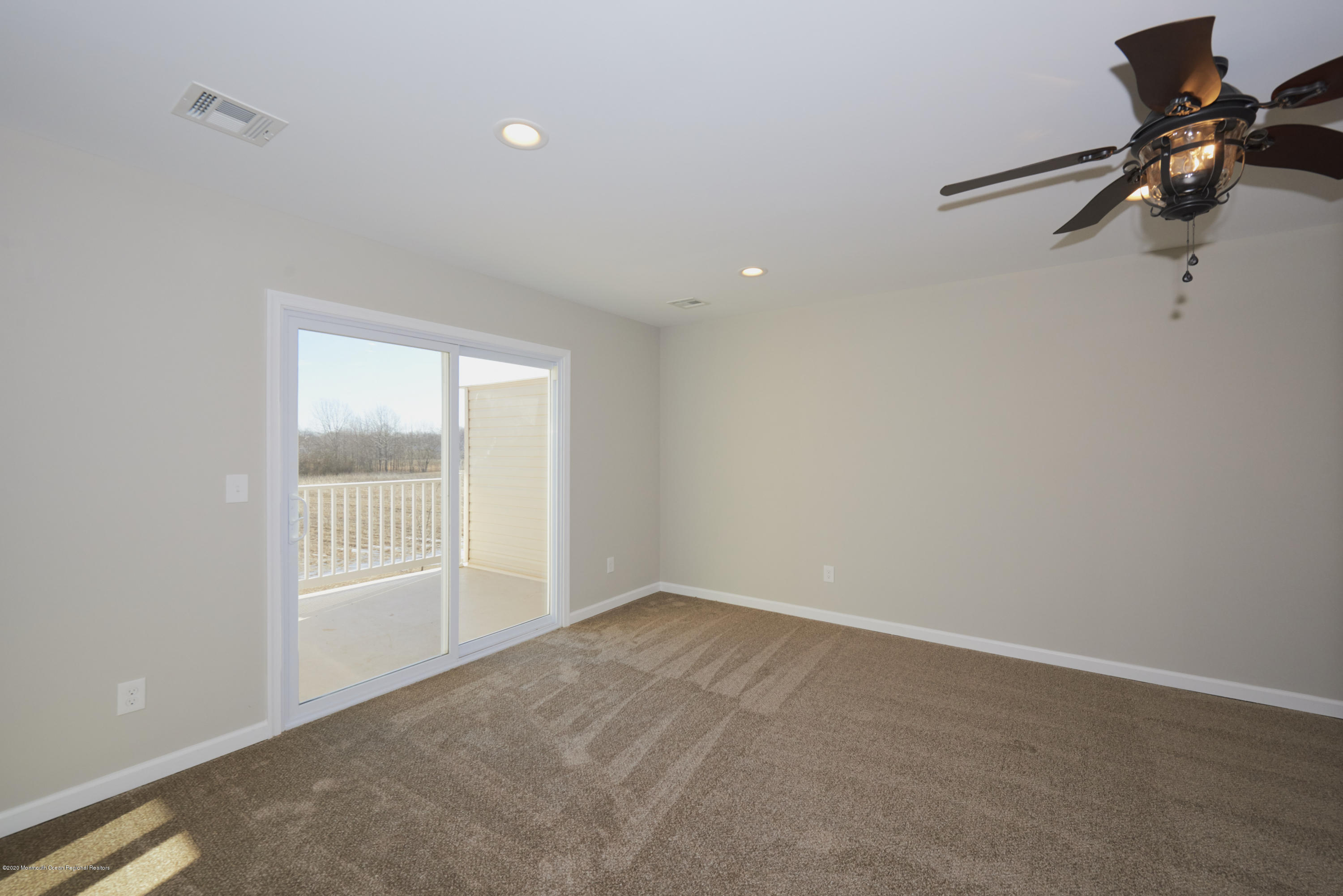 21 Green Tree Circle Hazlet, NJ 07730 - Photo 23 of 38 wooden floor in an empty room with a window