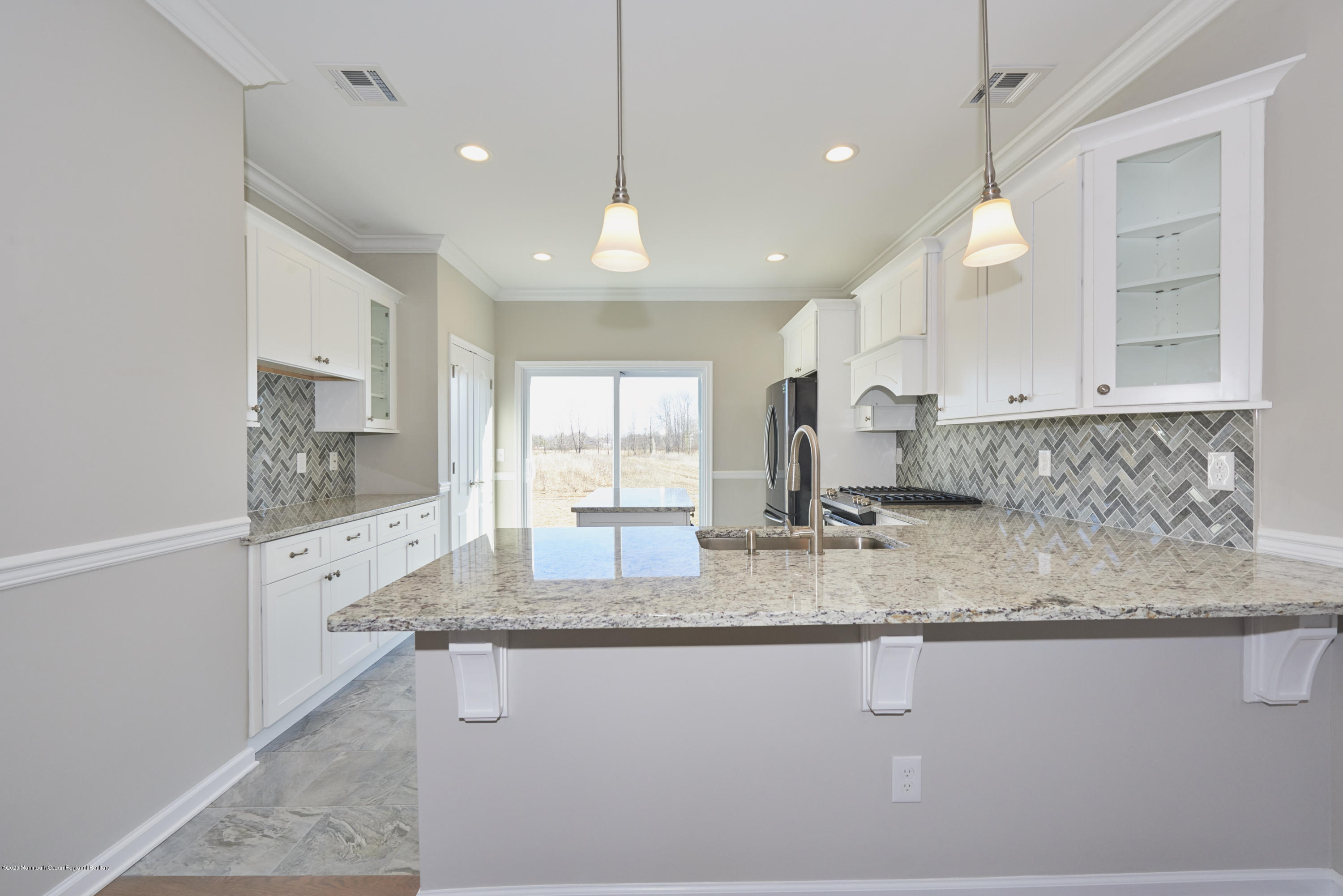 21 Green Tree Circle Hazlet, NJ 07730 - Photo 3 of 38 a kitchen with stainless steel appliances granite countertop a sink stove and cabinets