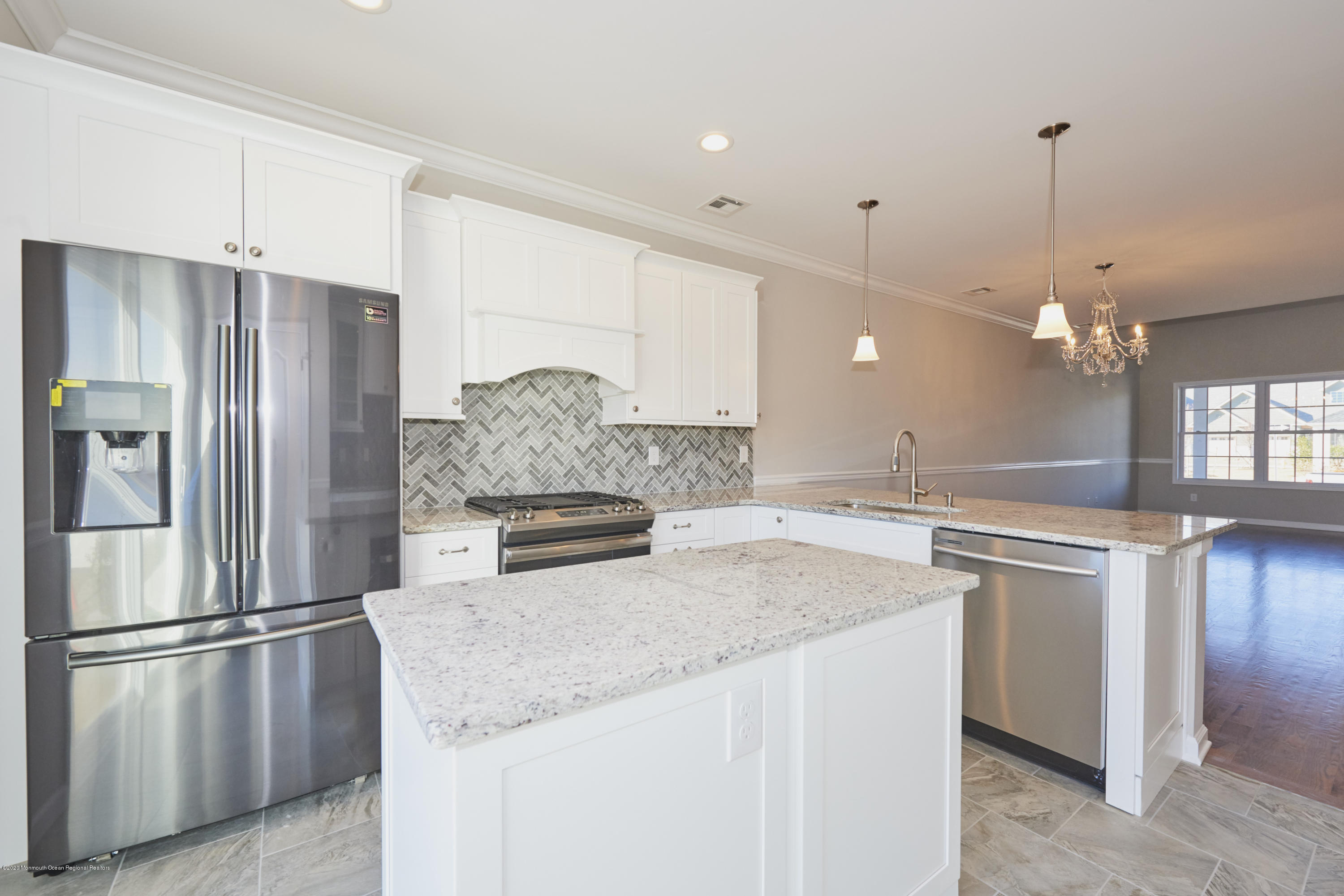 21 Green Tree Circle Hazlet, NJ 07730 - Photo 4 of 38 a kitchen with stainless steel appliances granite countertop a refrigerator a sink a stove and a refrigerator