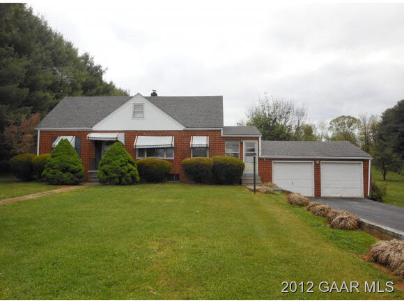 220 Henkel Road Waynesboro, VA 22980 - Photo 1 of 12 a front view of a house with a garden