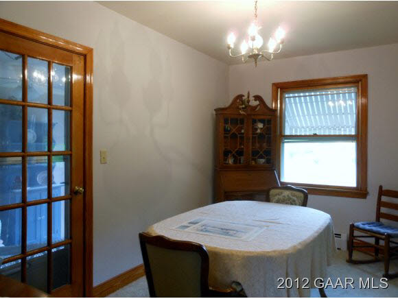 220 Henkel Road Waynesboro, VA 22980 - Photo 4 of 12 a room with a chandelier and a window