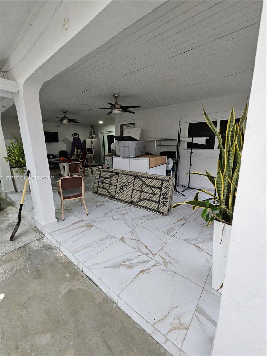Westview Miami, FL 33167 - Photo 21 of 46 a living room with furniture and a flat screen tv
