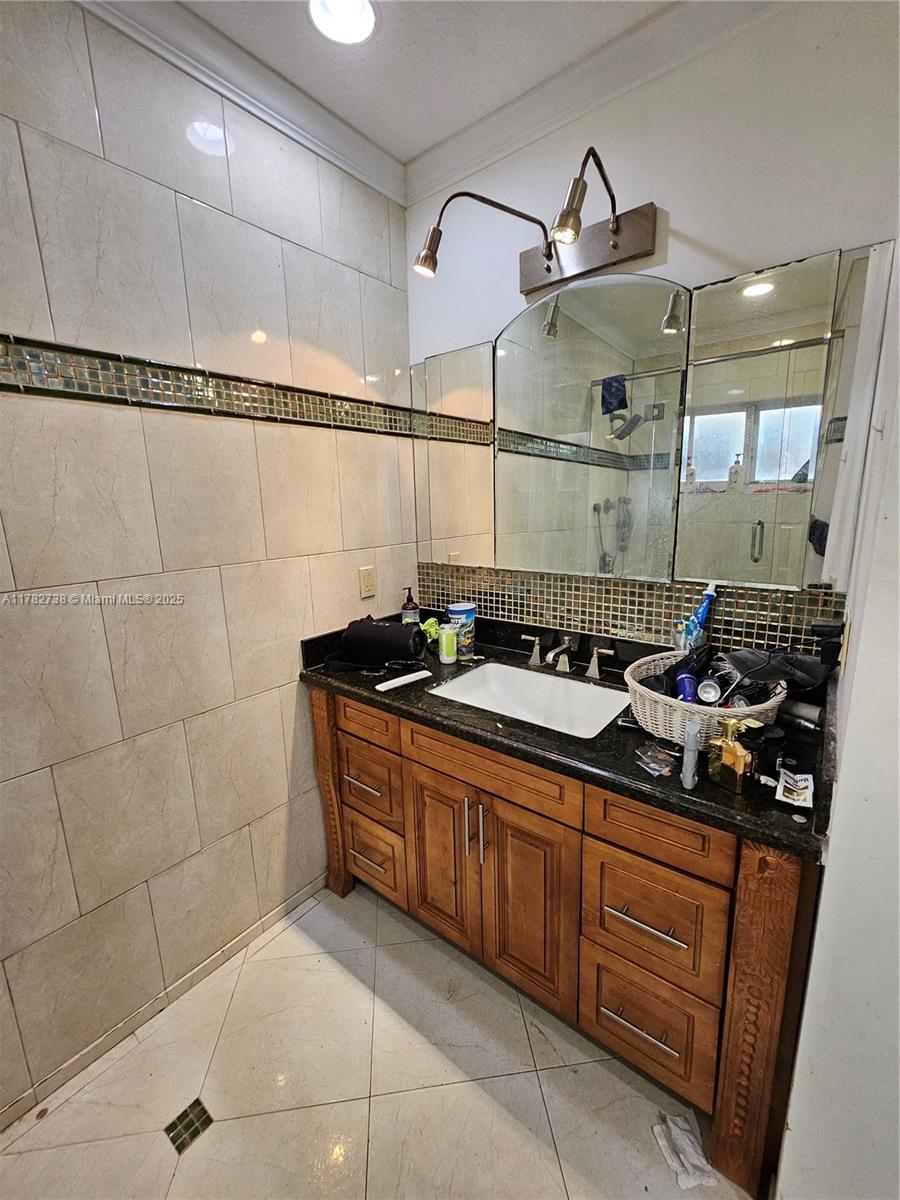 Westview Miami, FL 33167 - Photo 34 of 46 a bathroom with a sink and a mirror