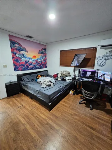 a living room with furniture flat screen tv and rug